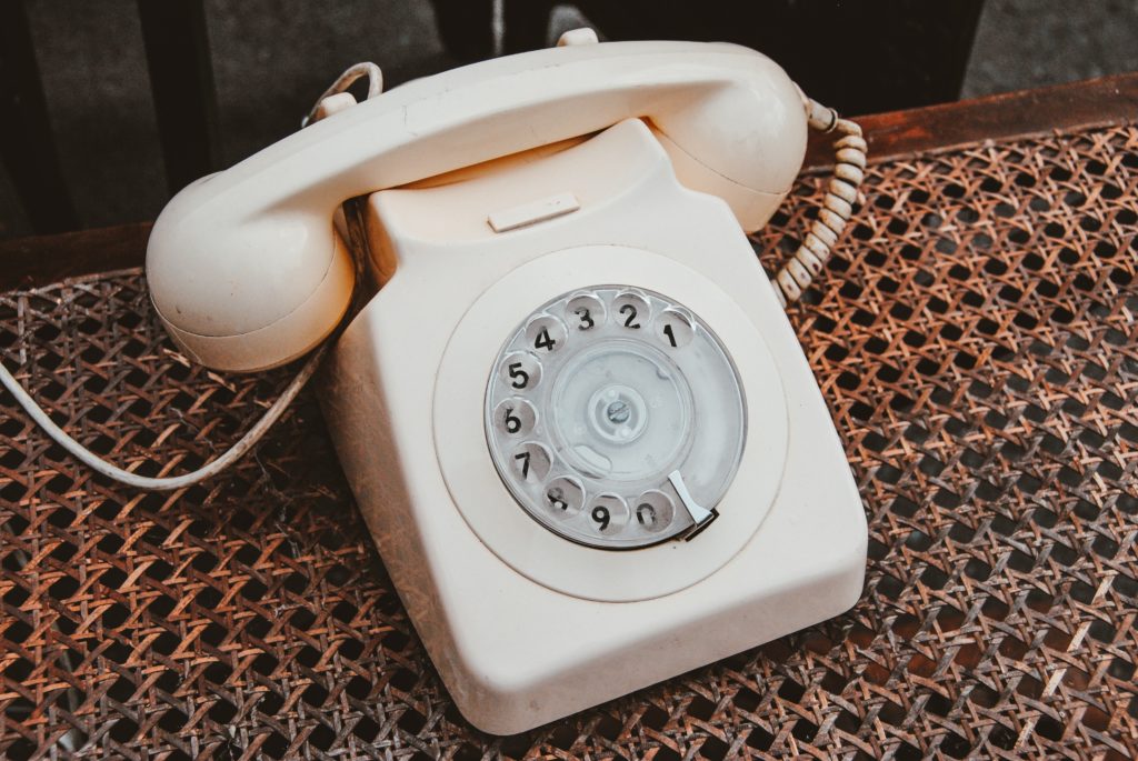 cream-colored rotary phone